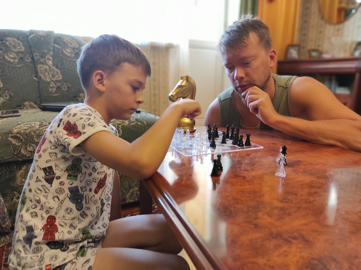 Playing chess: George and Leon