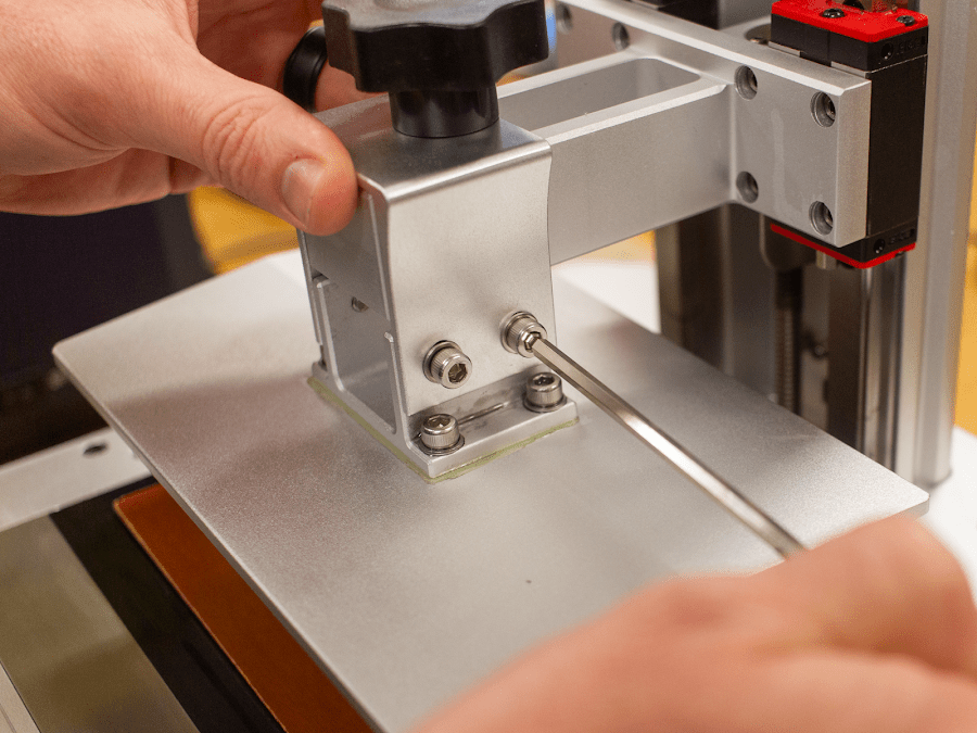 An SLA Printer build surface being leveled