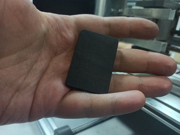 piece of ebony, 5 mm thick.