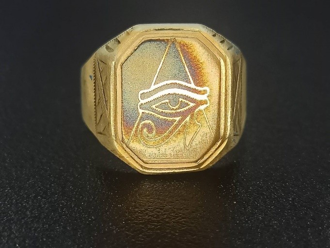 A colored image etched into a ring created by an Endurance laser