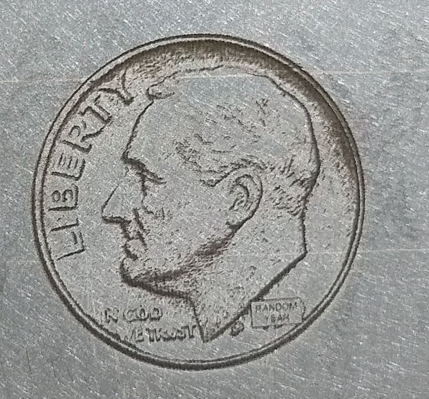 Laser coin engraving